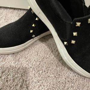 Clean suede shoes with gold stars